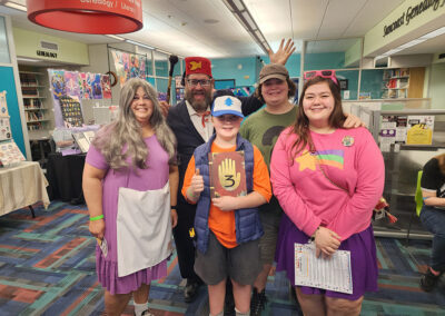 Family dressed in Gravity Falls costumes.